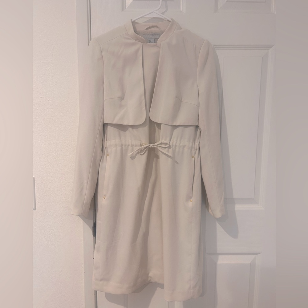 Cream trench coat with draw strings